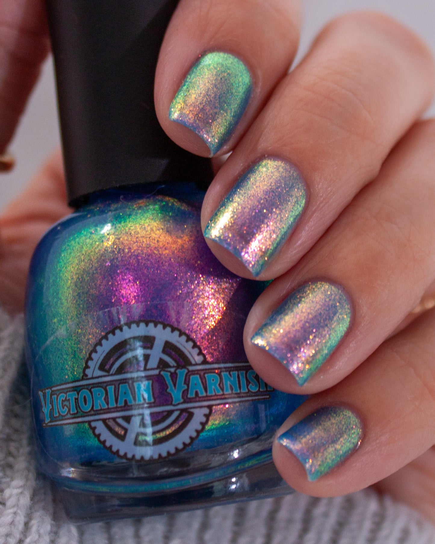 Kaleidoscopic - A blue jelly base with 2 iridescent multi chrome shimmers that display a multitude of different color patterns and shifts