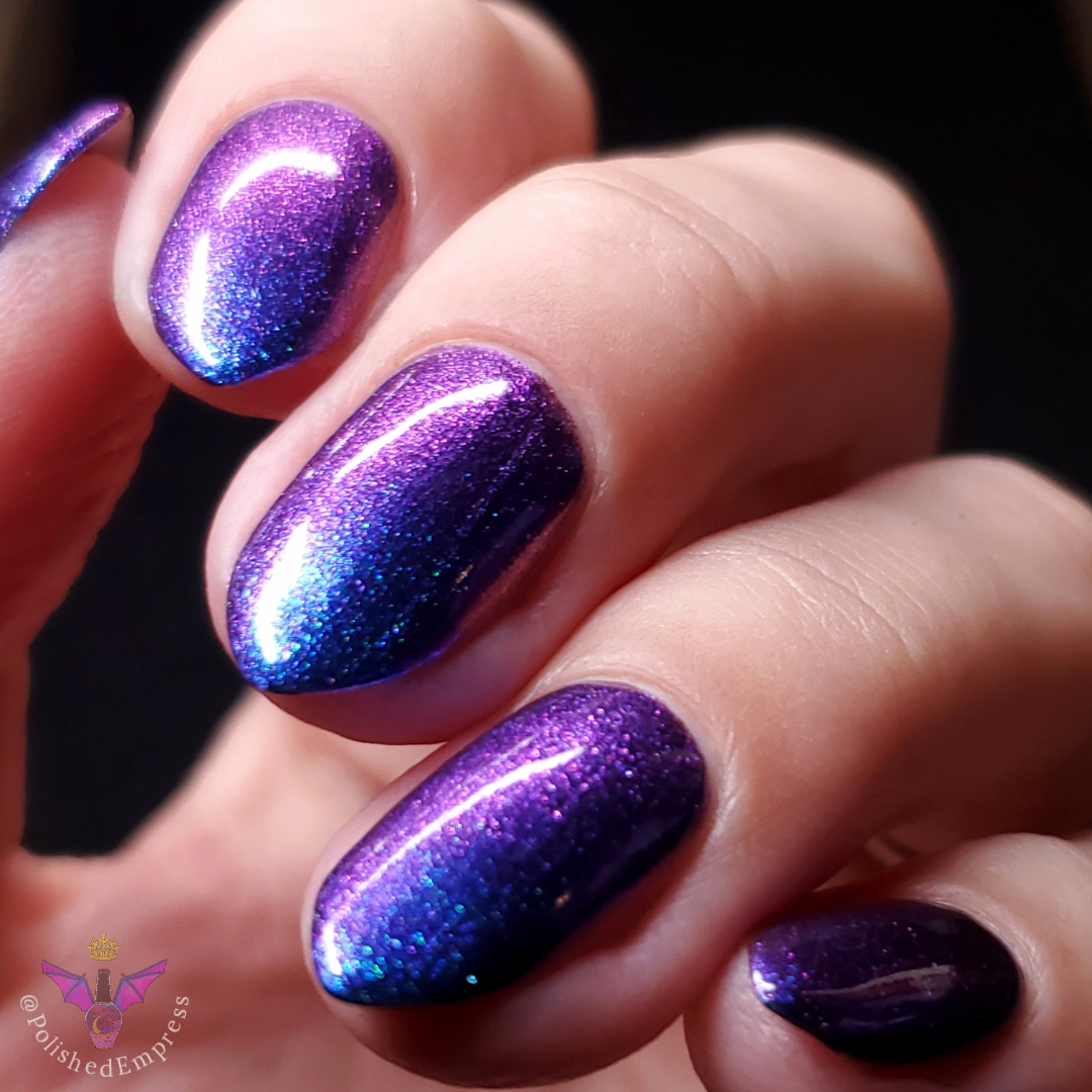 Hypnotic - A deep blue multichrome shifting from blue/teal/purple/pink/gold and a large particle green shifting shimmer (this is a sibling polish to Happy Never After) 
